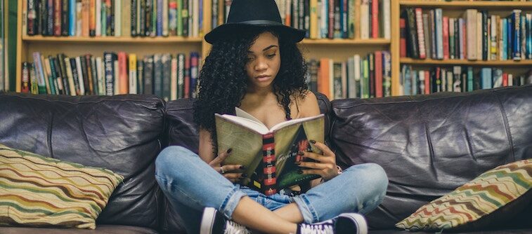 Young Woman Reading In a Library