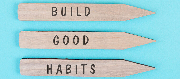 The words build good habits are standing on arrows, change lifestyle, healthy and positive attidude, motivation concept