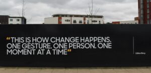 Quote on wall, "This is how change happens.One gesture. One person. One moment at a time."